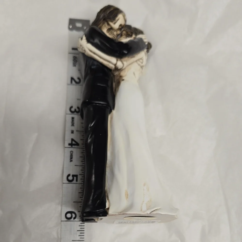Elegant Black and White Embracing Couple Figurine